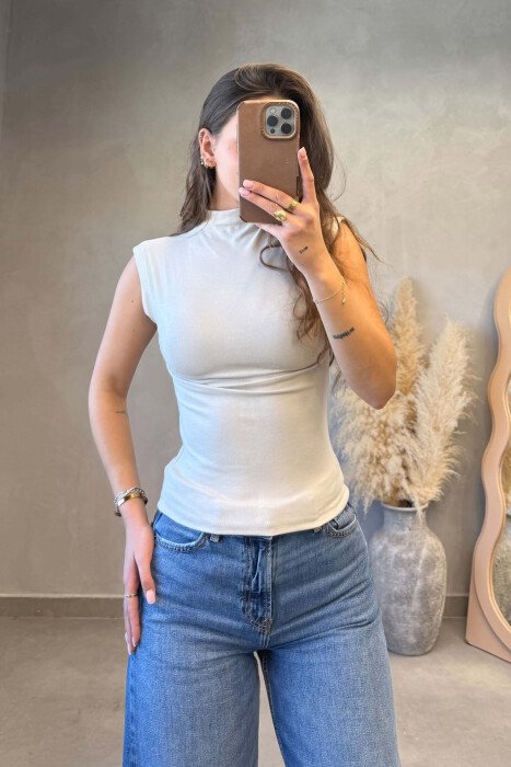 BLUZE PA MENGE ME GJYSEM GOLF PER FEMRA NE NGJYRE BEZHE 