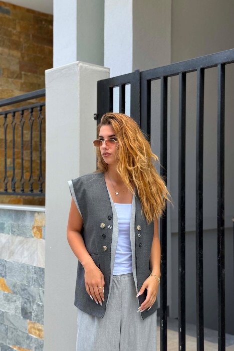  JELEK ME DETAJIN E BUTONAVE PER FEMRA NE NGJYRE GRI E ERRET - 3