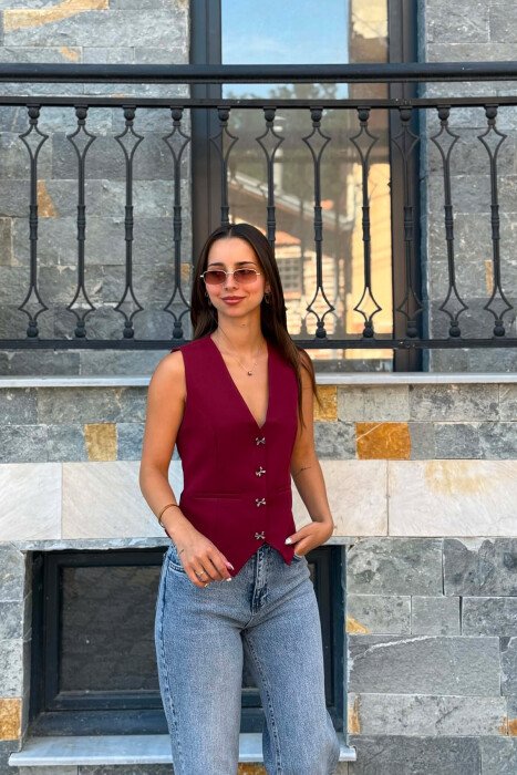 JELEK NJE NGJYRESH ME BUTONA NE FORME FJONGOSH PER FEMRA NE NGJYRE VISHNJE 