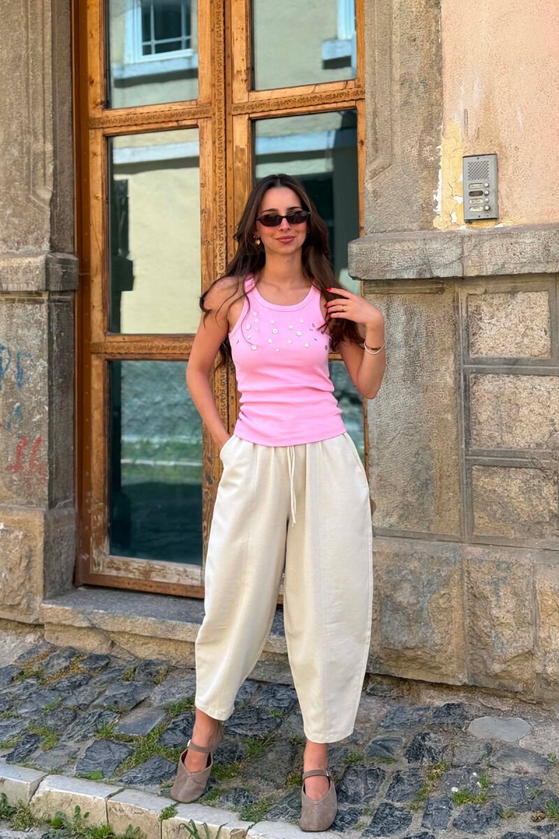KANATJERE NJE NGJYRESHE ME DETAJIN E BUTONAVE PER FEMRA NE NGJYRE ROZE - 6