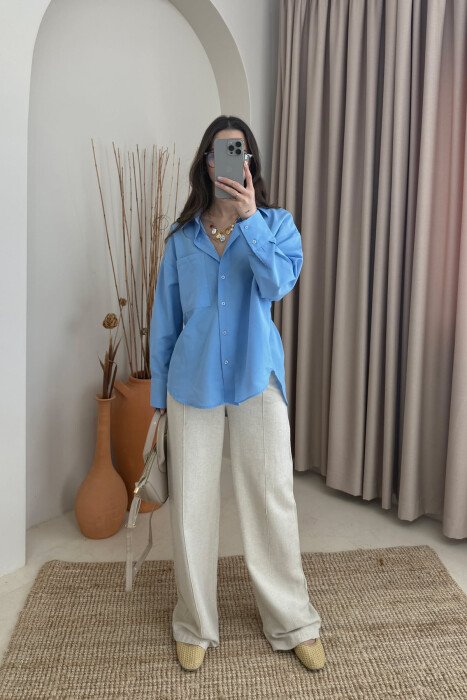 KËMISHË NJË NGJYRËSHE ME XHEP PËR FEMRA NË NGJYRËN BLU E ZBARDHUR - 4