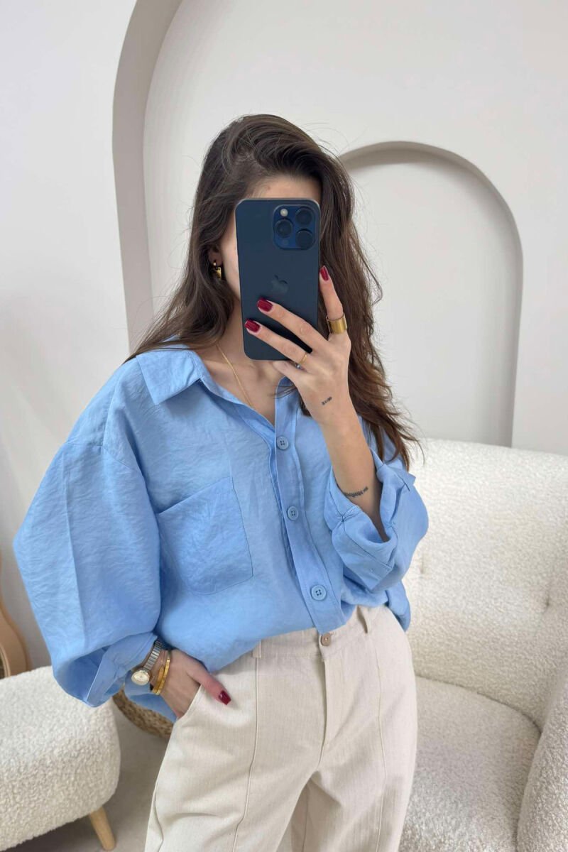 KËMISHË NJË NGJYRËSHE E THJESHTË PËR FEMRA NË NGJYRËN BLU E ZBARDHUR - 4