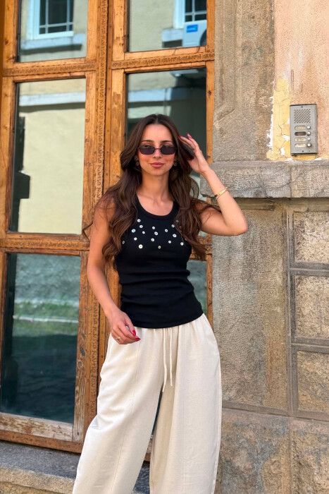 KANATJERE NJE NGJYRESHE ME DETAJIN E BUTONAVE PER FEMRA NE NGJYRE TE ZEZE - KLAUDIO FASHION