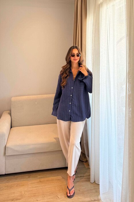KEMISHE NJE NGJYRESHE ME XHEP NE PJESEN PARA PER FEMRA NE NGJYRE BLU - KLAUDIO FASHION