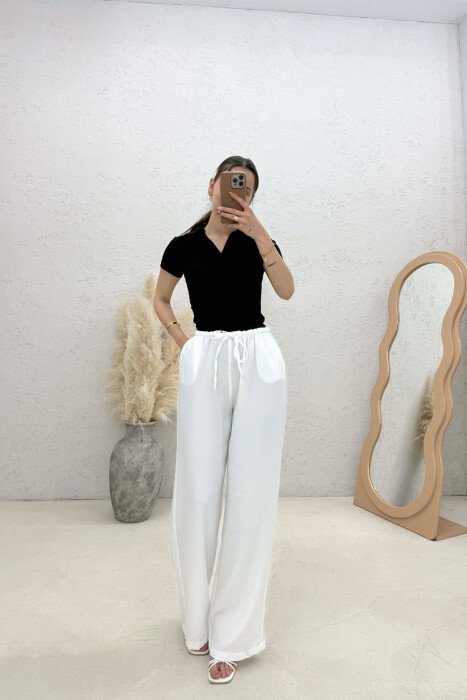 PANTALLONA ME BEL ELASTIK DHE ME DETAJIN E LIDHSEVE PER FEMRA NE NGJYRE TE BARDHE - KLAUDIO FASHION