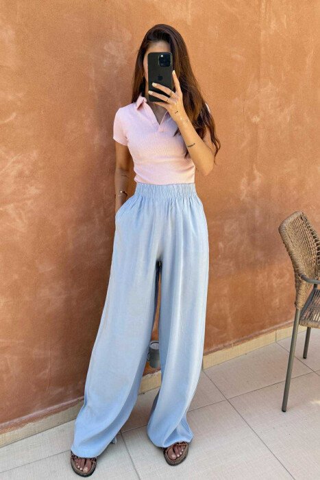 PANTALLONA NJË NGJYRËSHE TË THJESHTA PËR FEMRA NË NGJYRËN BABY BLUE - 3