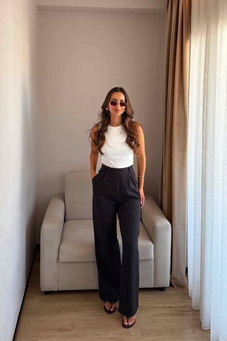 PANTALLONA TE GJERA ME DETAJIN E VIJAVE PER FEMRA NE NGJYRE TE ZEZE - KLAUDIO FASHION