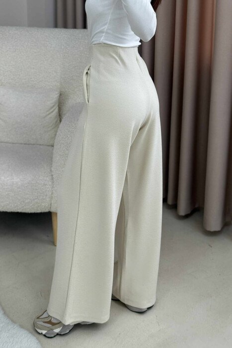 PANTALONA TE GJERA NJE NGJYRESHE ME BEL ELASTIK PER FEMRA NE NGJYRE KREM - 4