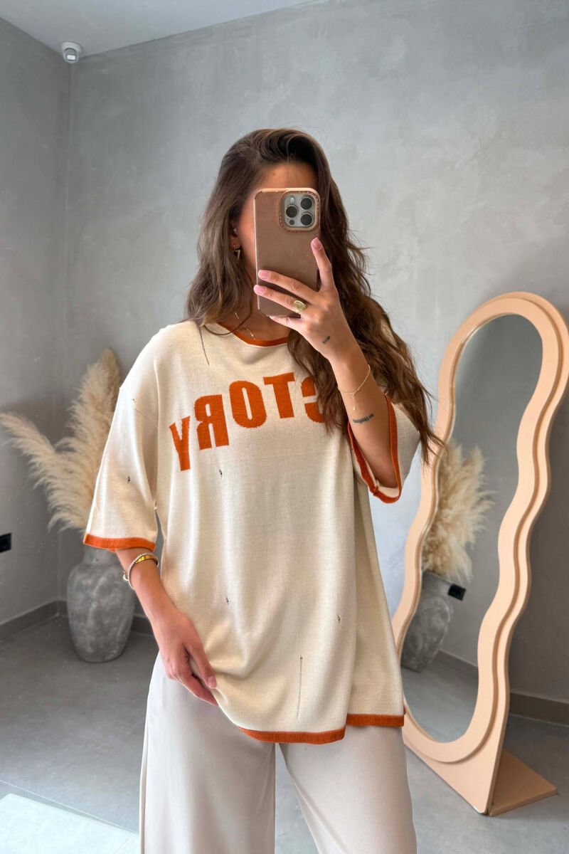 T-SHIRT ME SHKRIME NE PJESEN PARA PER FEMRA NE NGJYRE KREM - 1