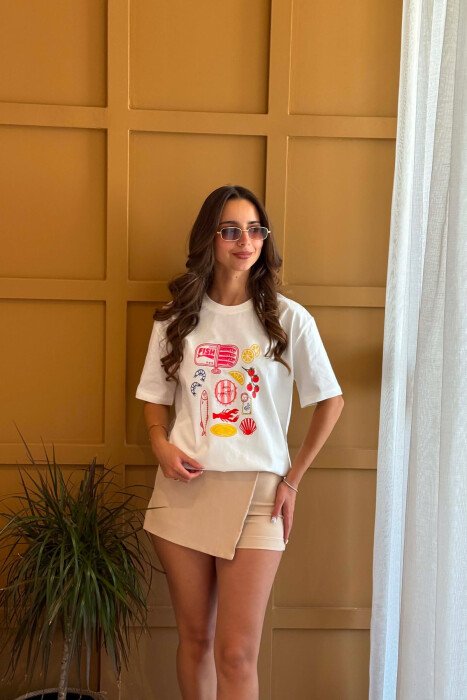 T-SHIRT NJE NGJYRESH ME IMAZH NE PJESEN PARA PER FEMRA NE NGJYRE TE BARDHE - KLAUDIO FASHION
